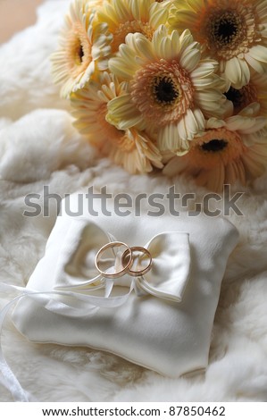 stock photo bride bouquet of yellow flowers and cushion with wedding gold