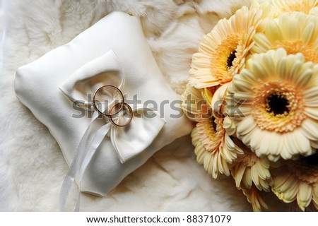 stock photo bride bouquet of yellow flowers and cushion with wedding gold