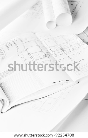 heap of design and project drawings on  table  background.