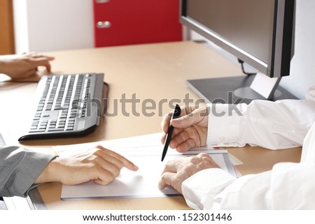two business people are meeting in office