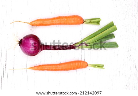 Carrot isolated on white with onion background