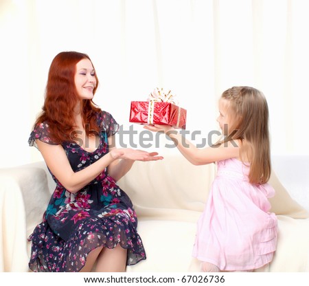 Girl gives present to mother