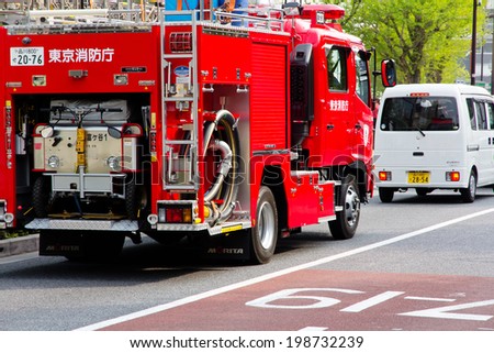 TOKYO, JAPAN - APRIL 16 2014: Fire engine on harajuku street on APRIL 16, 2014 in Tokyo,Japan