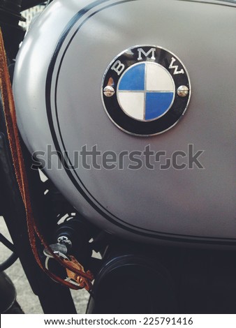 BANGKOK, THAILAND - JULY 23, 2014: The BMW-known logo at a historic BMW-Motorbike (Berlin-Germany). BMW is a German automobile, motorcycle and engine manufacturing company founded in 1916.