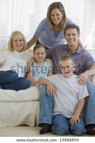 Extended family portrait sitting on a couch