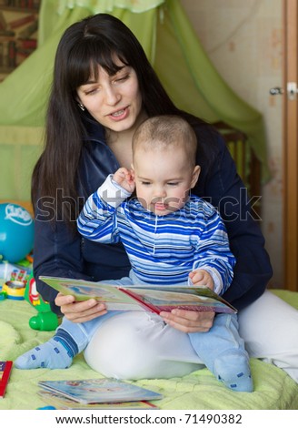 Mom and the little boy reading a book
