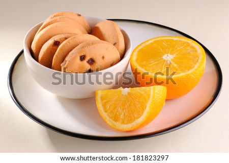 oranges cookies in a small bow with  orange