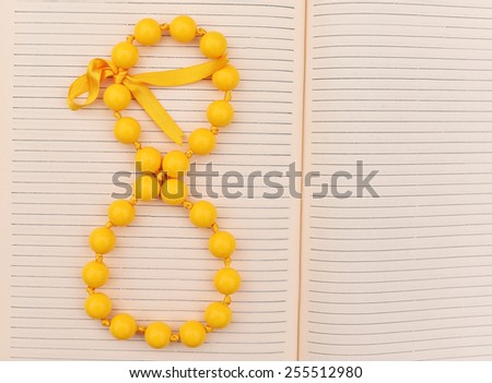 Happy woman\'s day, with yellow bead and bow