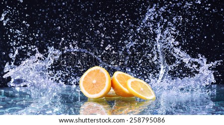 Macro water splash on lemon. Water drops with juicy lemon