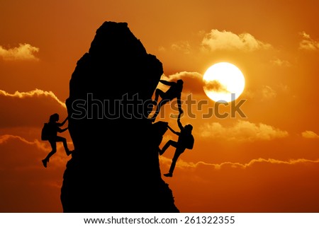 The joint work teamwork of two men travelers and girl help each other on top of a mountain climbing team, a beautiful sunset landscape