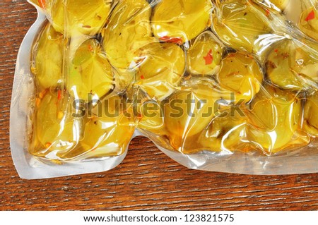 Seasoned green olives in a vacuum packaging, italian food