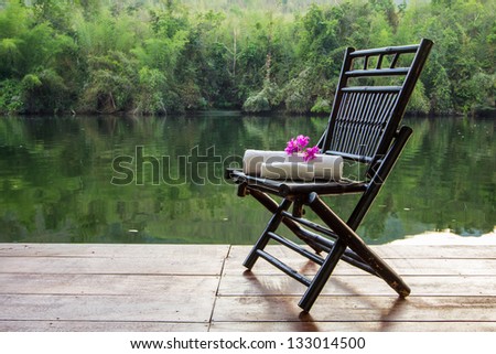 Towel set on the chair beside the river