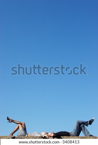 couple lying under the sky