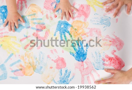 child hands colorful painting
