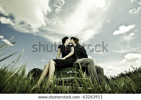 couple kissing in car. couple are kissing on a