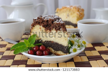 piece of cheesecake pie with poppy layer to coffee