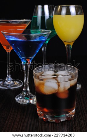 Colorful drinks in various glasses