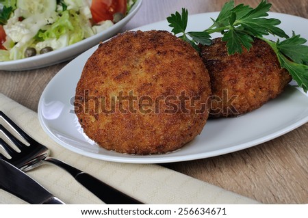 Chicken cutlets in bread crumbs on the dining table