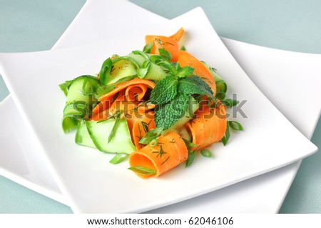 Zucchini salad with carrots and garlic marinade with herbs