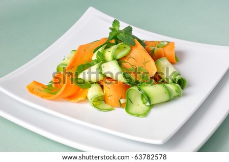 Zucchini salad with carrots and garlic marinade with herbs