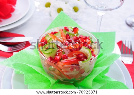 Fruit and vegetable salad with pomegranate seeds and sesame seeds