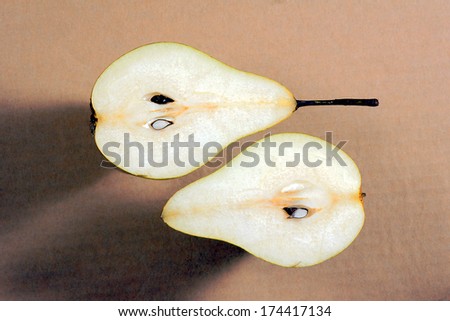 The cut pears on gray background