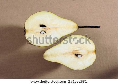 The cut pears on gray background