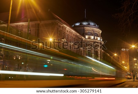 Tram in front of the Medical University in Poznan  at night