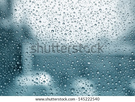 Water Drops on window with soft blurry background