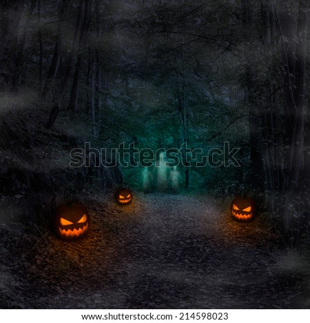 Path in spooky forest with pumpkin lanterns and ghosts