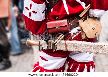 Landsknecht historical costume detail with sword, leather bags and mallets