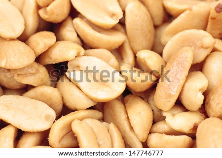 Close-up of a group of salted roasted peanuts