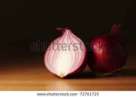 Half of a red onion and a whole red onion