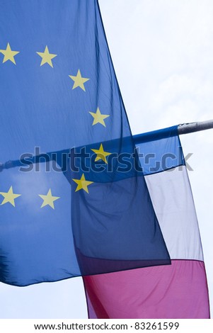 A European Union flag and a French flag flying together