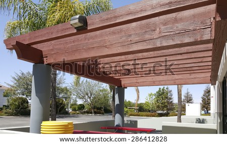 Basic wooden pergola with security light