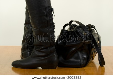 Black Leather Female Boots and a Bag