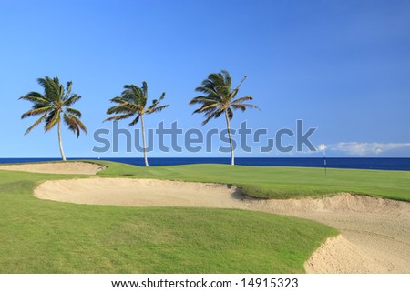 Green Golf Course with Sand Traps on Ocean Shore of Kona Island, HI