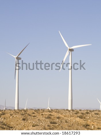Blue Sky Smoke Free behind Electric Wind Mill Turbine
