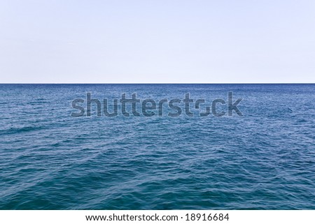 Blue Waters of Wide Open Ocean and Pure Clean Sky Background