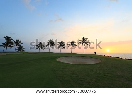 Vacationers Silhouette enjoying Ocean Sunset from Golf Course, Kona Island, HI