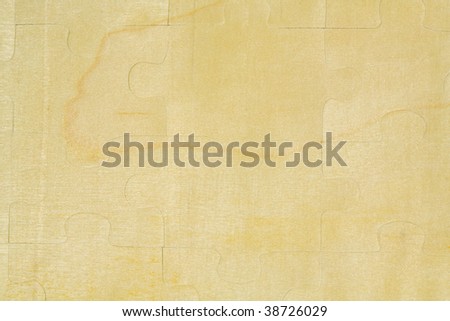 Wooden jigsaw puzzle background, close up, macro view