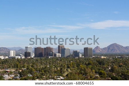 Arizona capital city of Phoenix uptown against east valley mountains