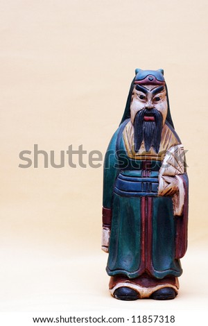 wooden statue of an old chinese man