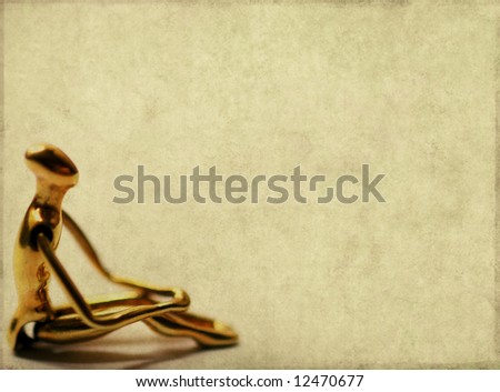 lovely brown background image with interesting earthy texture, close-up of a golden figure and plenty of space for text