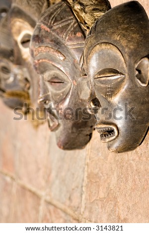 Traditional african mask, handmade from wood, shells, horns, straw, rope, woven, looks very old