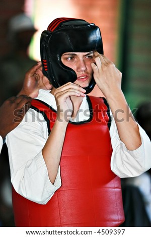 Young man preparing to fight at a martial arts tournament