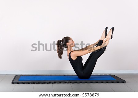 Teaser exercise. Pilates gymnastics is a Germanic evolution of yoga, used by athletes to improve flexibility and body fitness and by chiropractors for patient recovery.