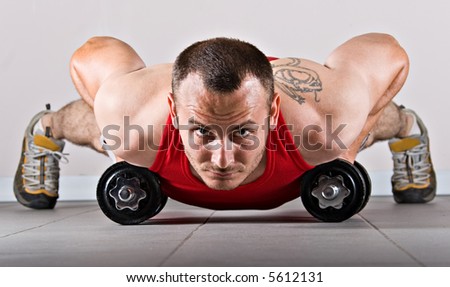 Pushups For Biceps. stock photo : Push up with dumbbells, classic endurance exercise for iceps