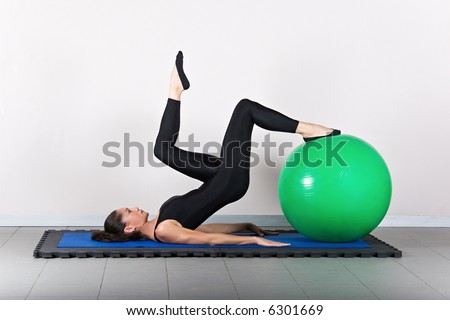 Hamstring curl one leg   with ball position. Pilates gymnastics is a Germanic evolution of yoga, used by athletes to improve flexibility and body fitness and by chiropractors for patient recovery.