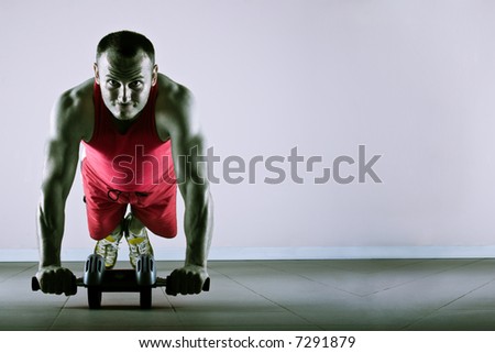 Push up with exercise wheel dramatization, classic endurance workout for biceps